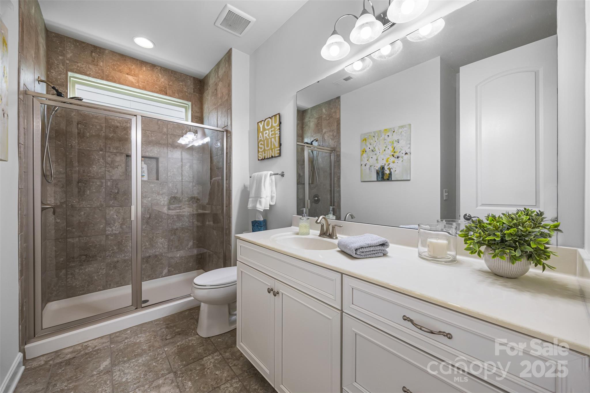 1284 Independence Street Fort Mill, SC 29708 - Photo 12 of 34 a bathroom with a sink a toilet and shower