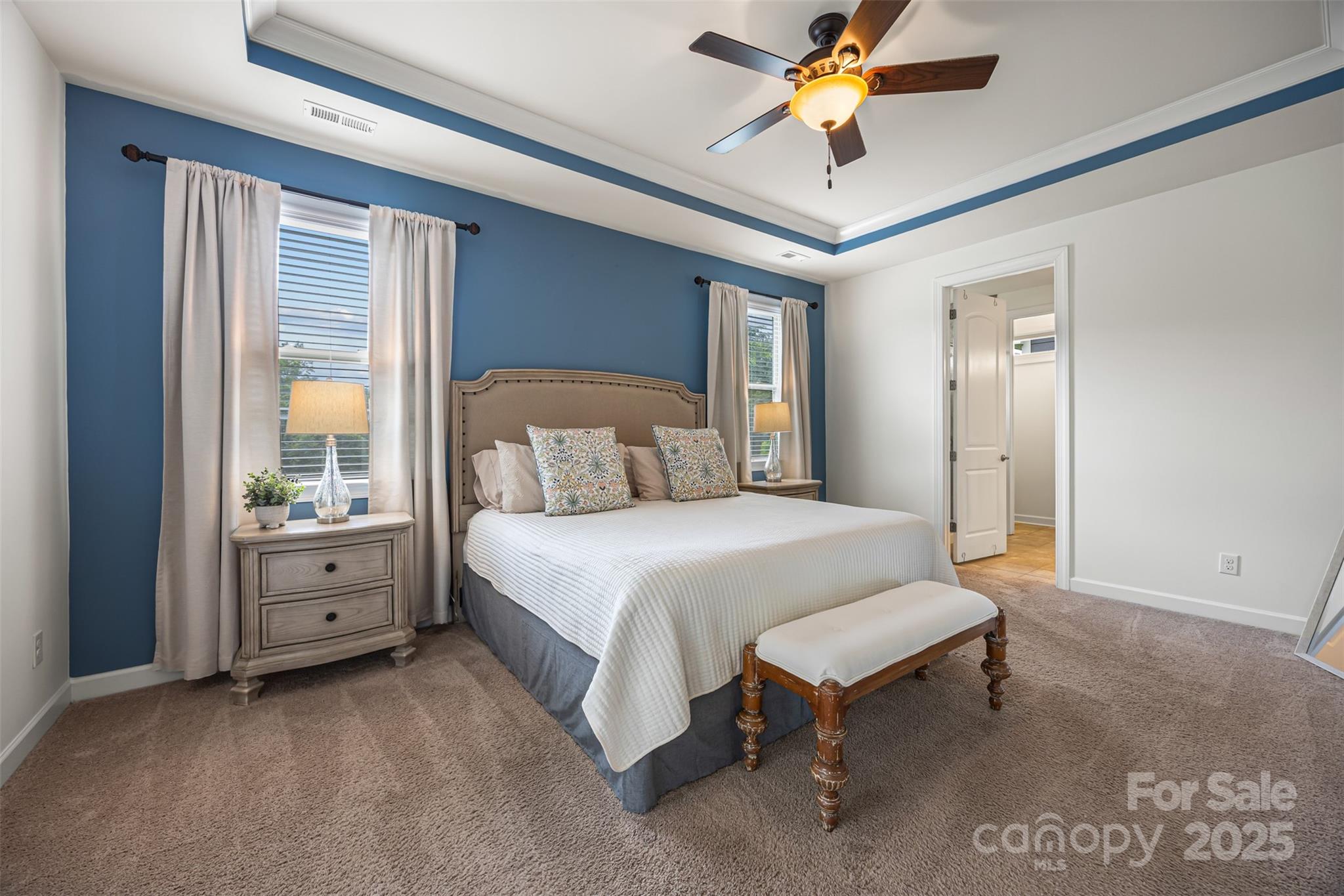 1284 Independence Street Fort Mill, SC 29708 - Photo 13 of 34 a spacious bedroom with a bed and a chandelier