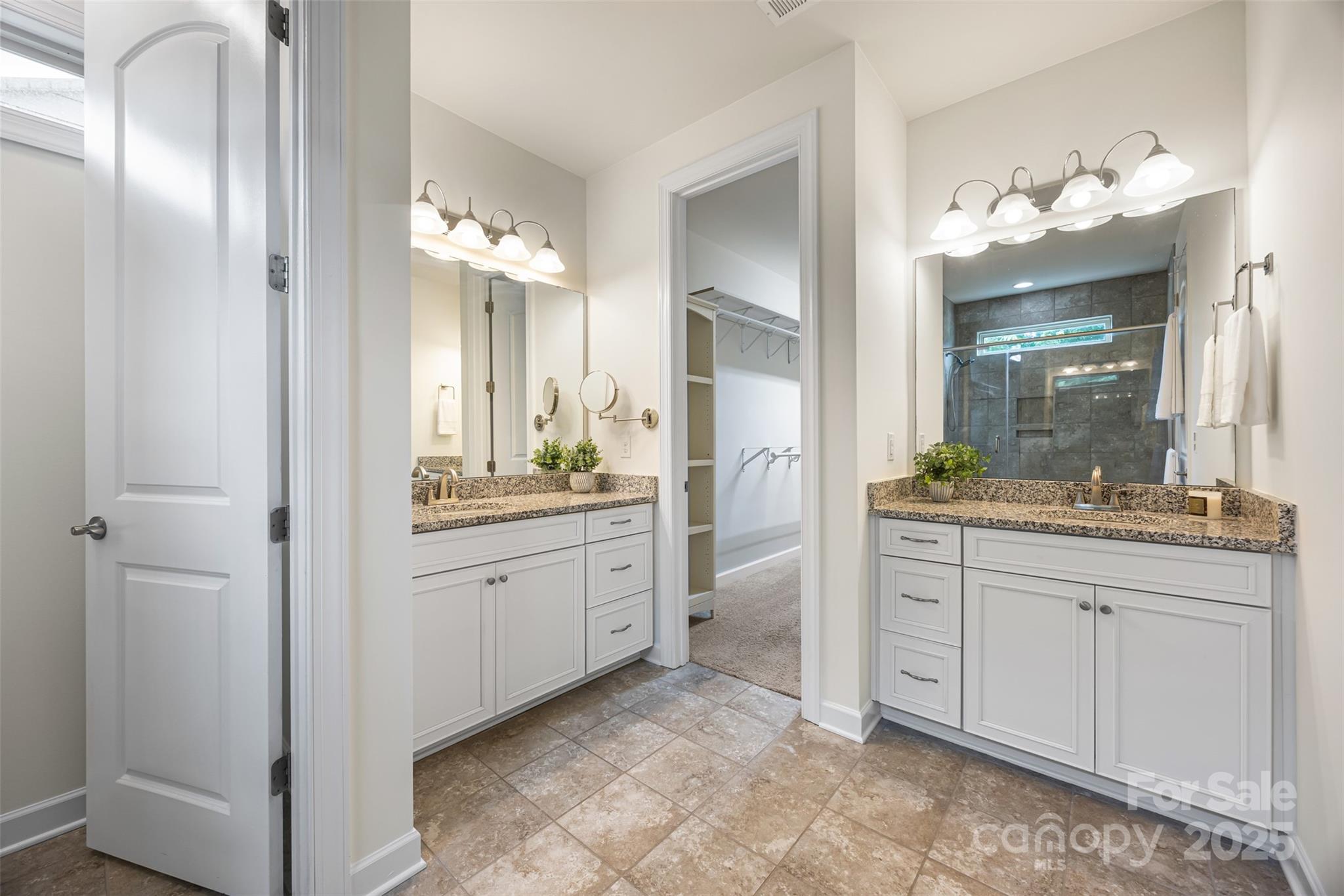 1284 Independence Street Fort Mill, SC 29708 - Photo 17 of 34 a spacious bathroom with a granite countertop sink a mirror and a shower