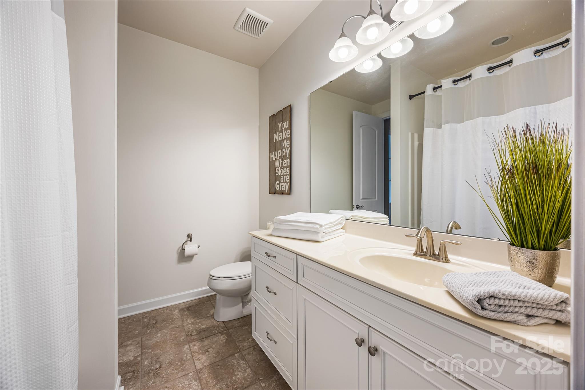 1284 Independence Street Fort Mill, SC 29708 - Photo 22 of 34 a bathroom with a granite countertop toilet sink and mirror