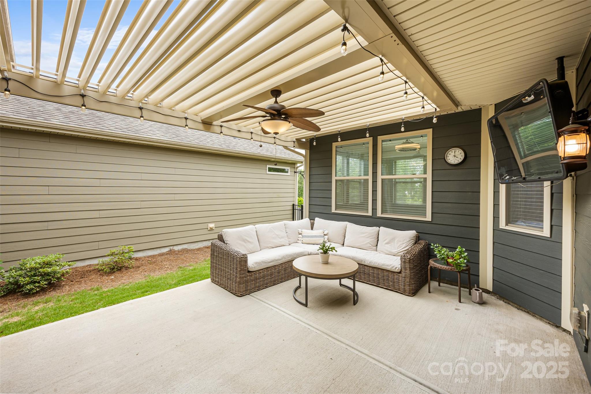 1284 Independence Street Fort Mill, SC 29708 - Photo 26 of 34 a view of a patio with a table and chairs and a barbeque