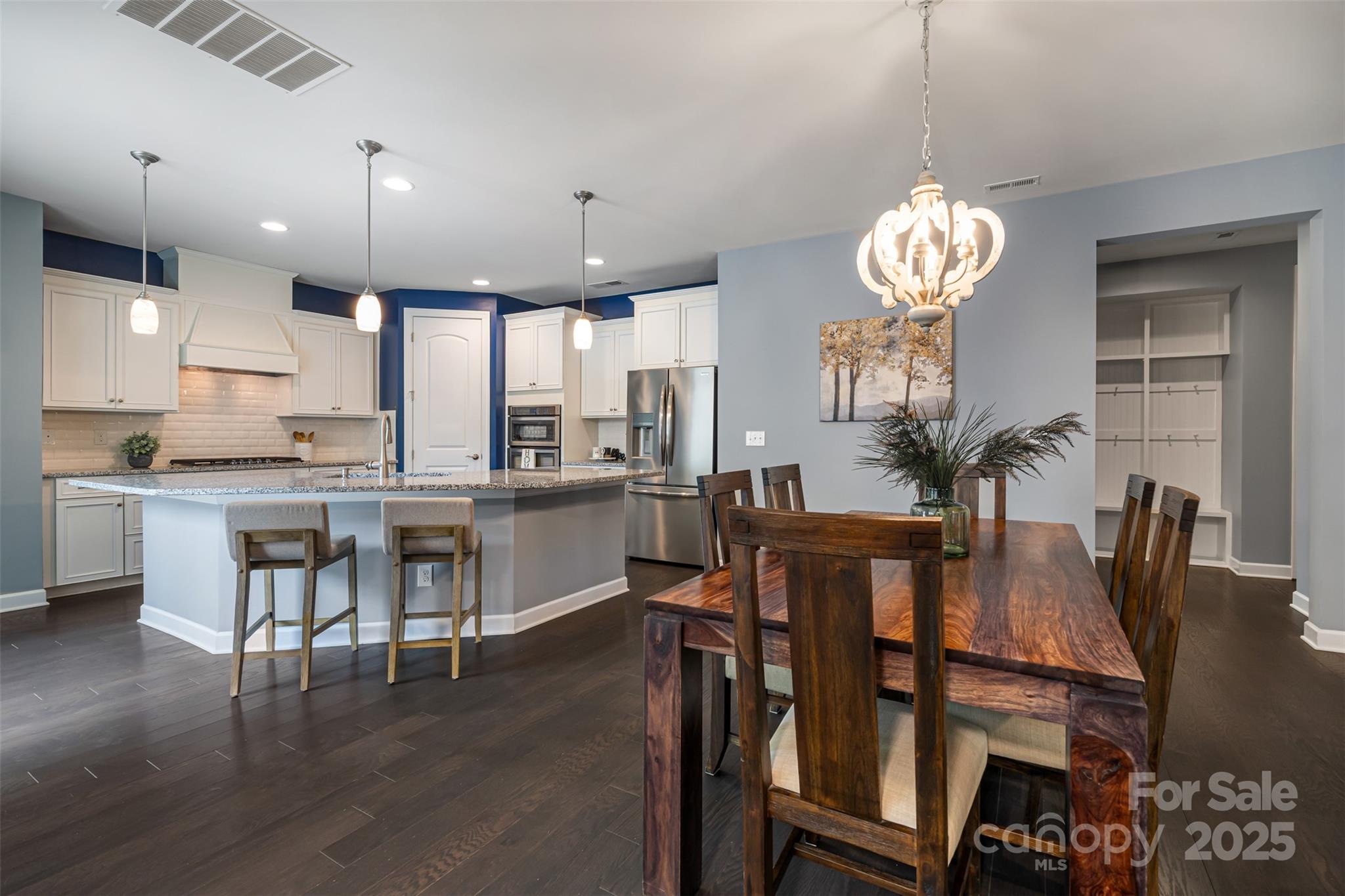 1284 Independence Street Fort Mill, SC 29708 - Photo 6 of 34 a view of a dining room with furniture wooden floor and chandelier