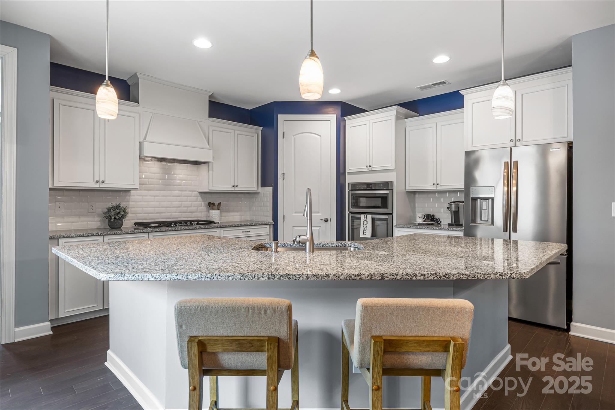 1284 Independence Street Fort Mill, SC 29708 - Photo 7 of 34 a kitchen with stainless steel appliances granite countertop a sink refrigerator and cabinets