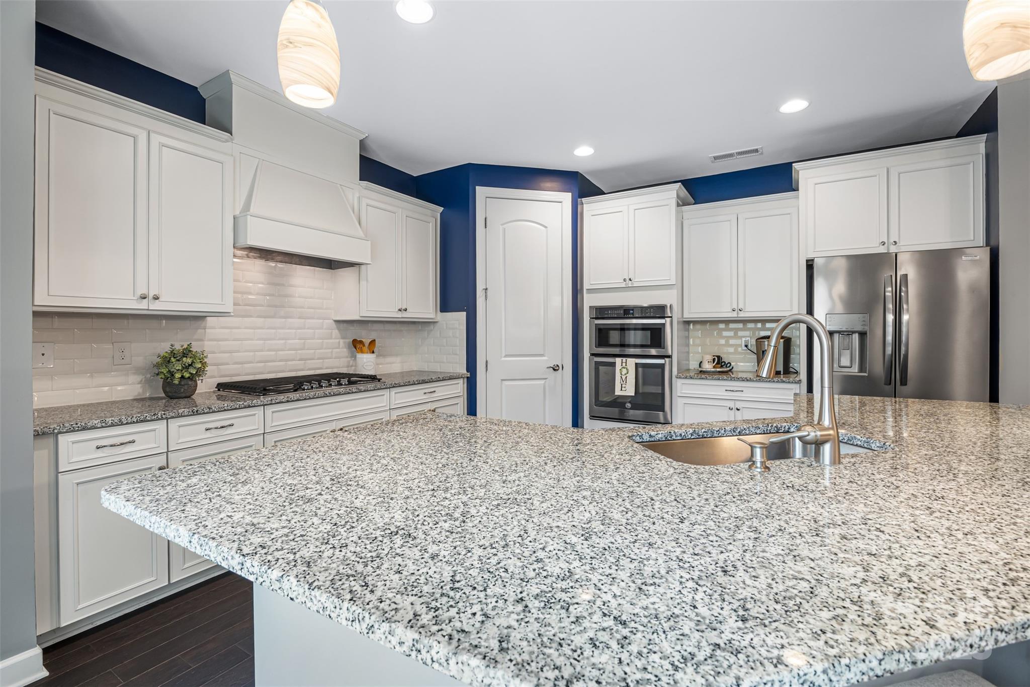 1284 Independence Street Fort Mill, SC 29708 - Photo 8 of 34 a kitchen with stainless steel appliances granite countertop a sink refrigerator and cabinets