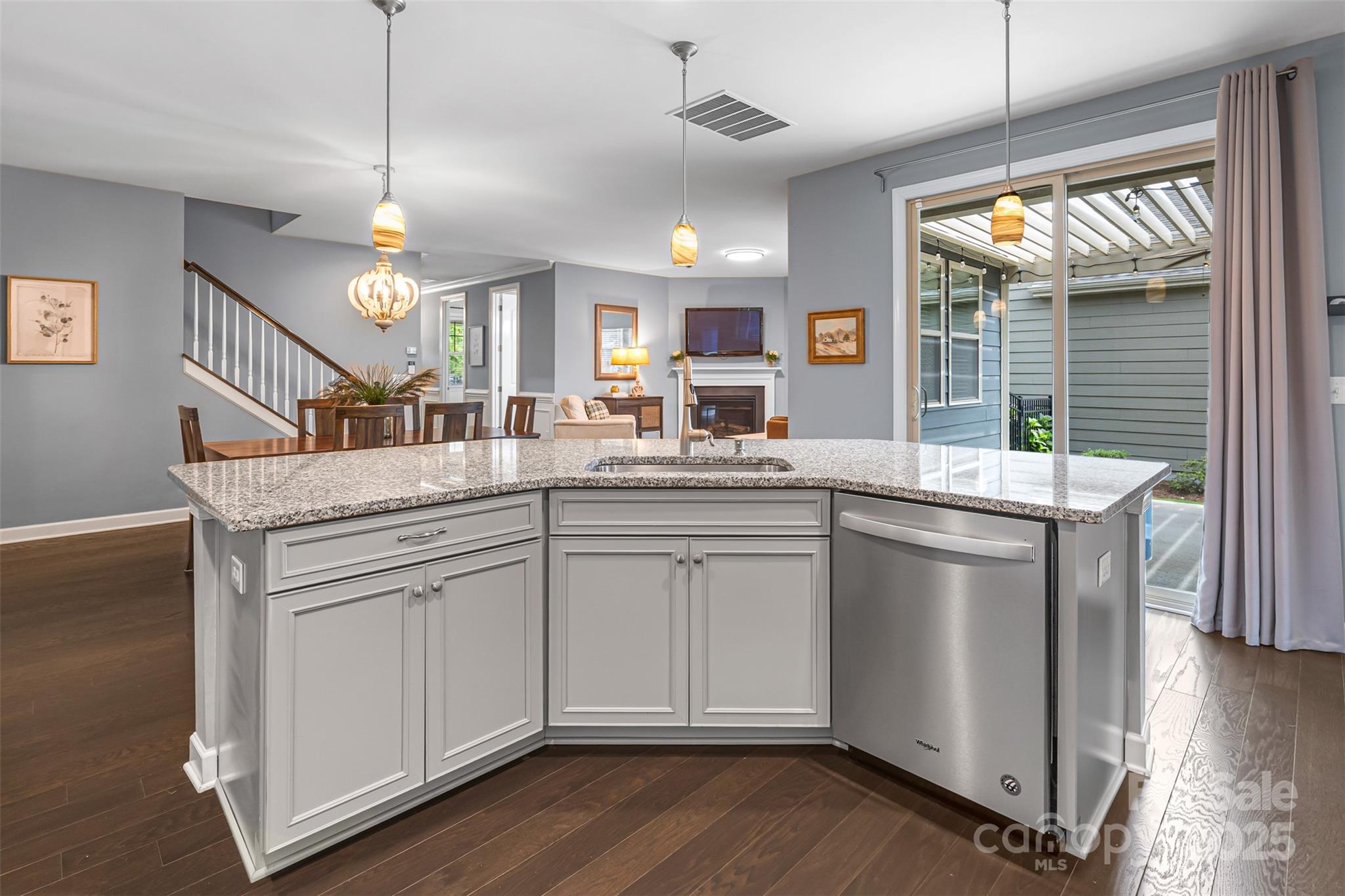 1284 Independence Street Fort Mill, SC 29708 - Photo 9 of 34 a kitchen with stainless steel appliances granite countertop a sink and dishwasher with wooden floor