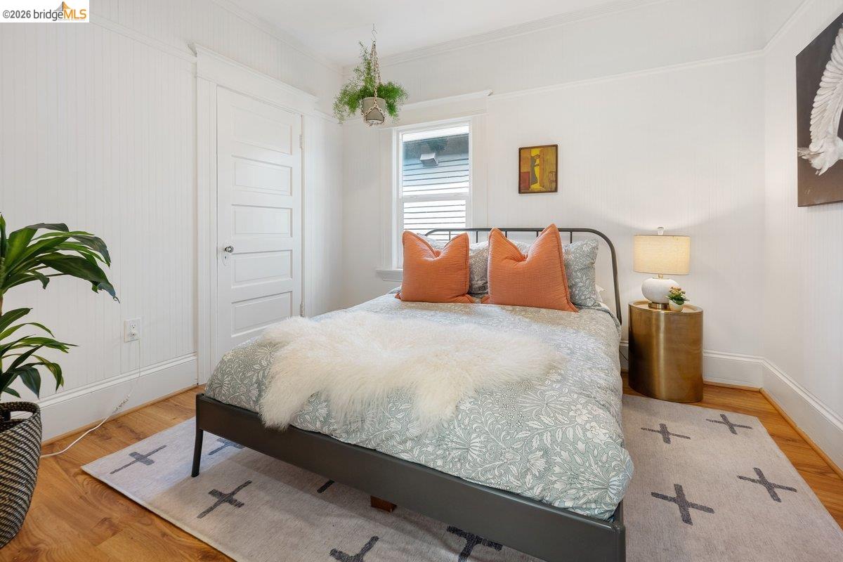 4369 Howe Street Oakland, CA 94611 - Photo 13 of 38 a bedroom with a bed and painting on the wall