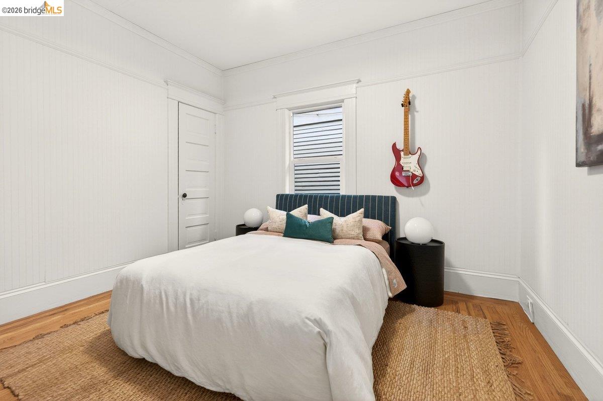 4369 Howe Street Oakland, CA 94611 - Photo 14 of 38 a bedroom with a bed and a window