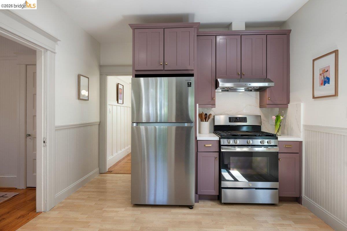4369 Howe Street Oakland, CA 94611 - Photo 19 of 38 a kitchen with a stove and a refrigerator
