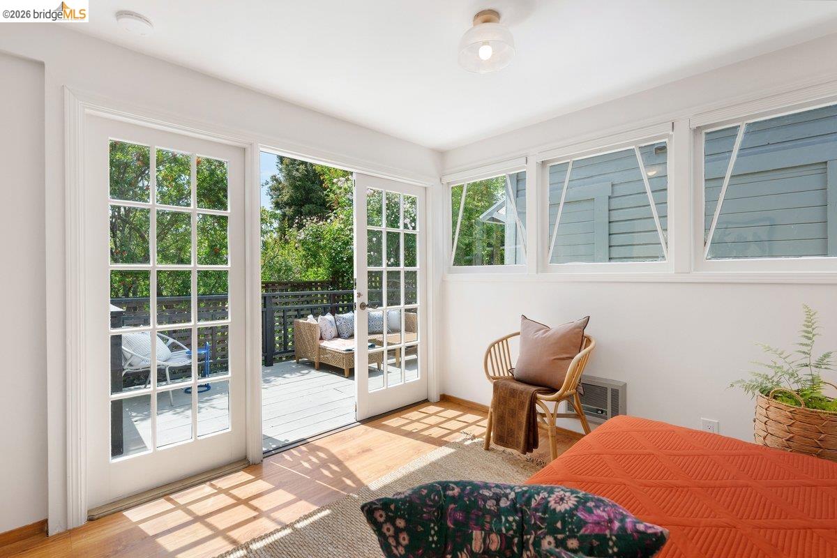 4369 Howe Street Oakland, CA 94611 - Photo 23 of 38 a bedroom with a bed and wooden floor