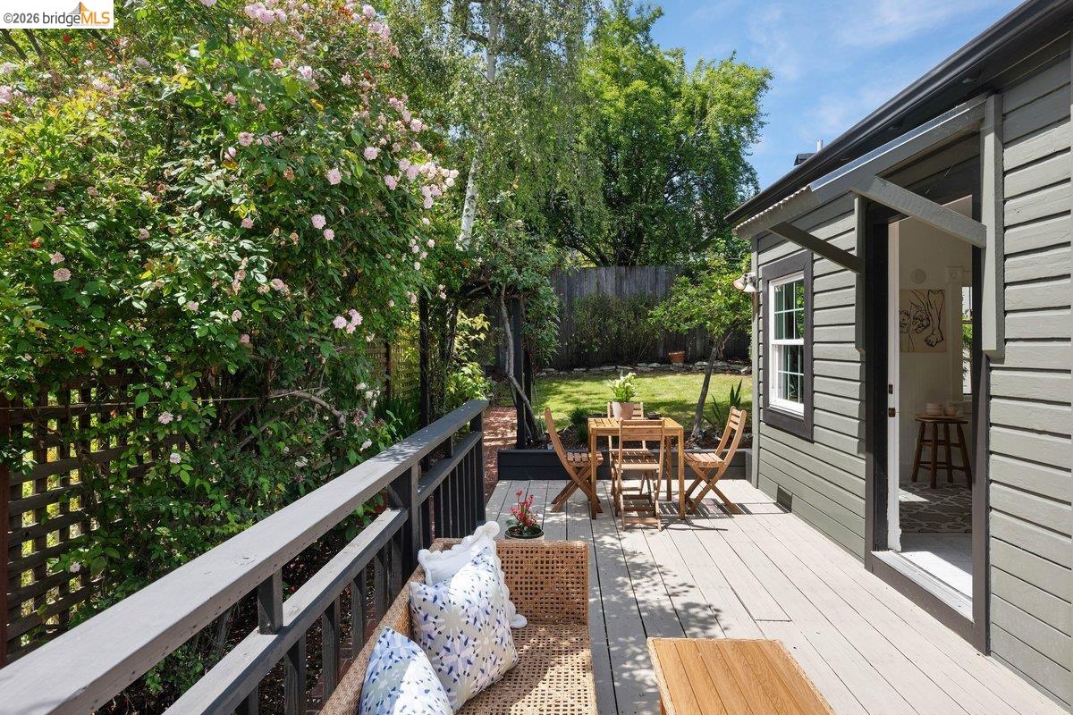 4369 Howe Street Oakland, CA 94611 - Photo 25 of 38 a view of deck with furniture and trees around