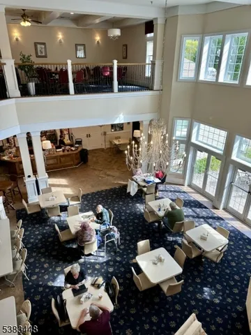 a room with lots of chairs and mirrors