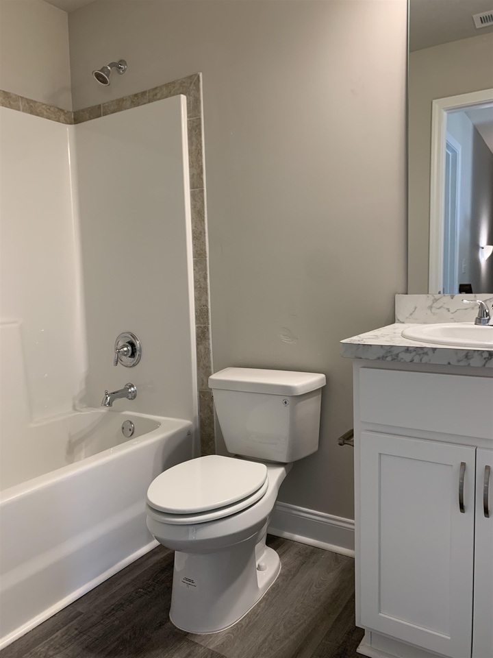 20 Joshua Creek Road, Unit 1 Covington, GA 30016 - Photo 1 of 1 a bathroom with a toilet a sink and bathtub