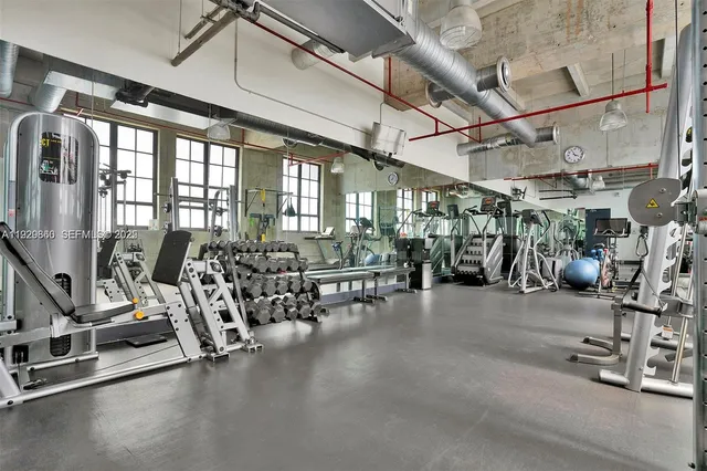 a kitchen with a white cabinets and stainless steel appliances