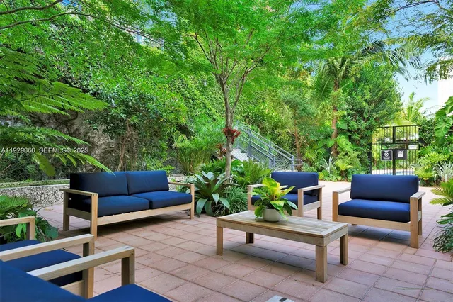 a view of a pathway with a patio