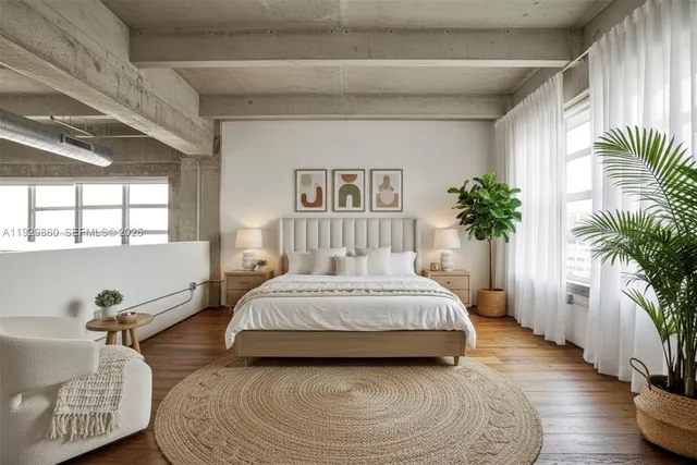 a spacious bedroom with a bed and a window