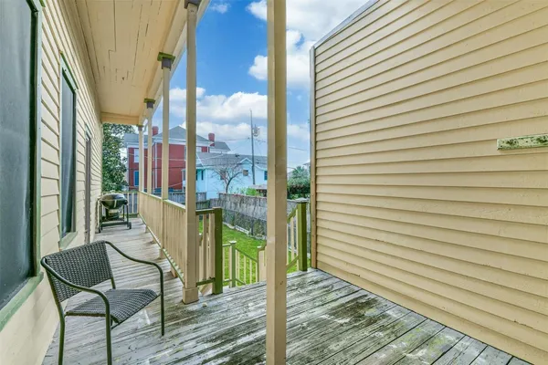 a view of a balcony with chairs