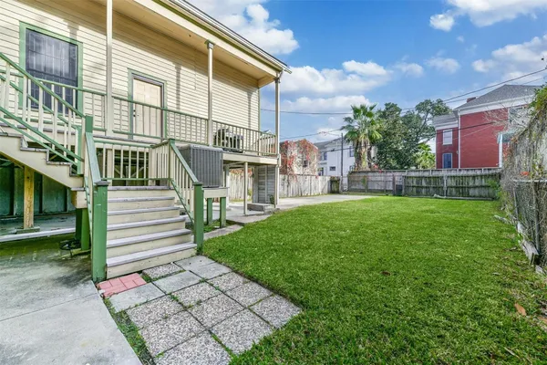 a view of a building with a yard