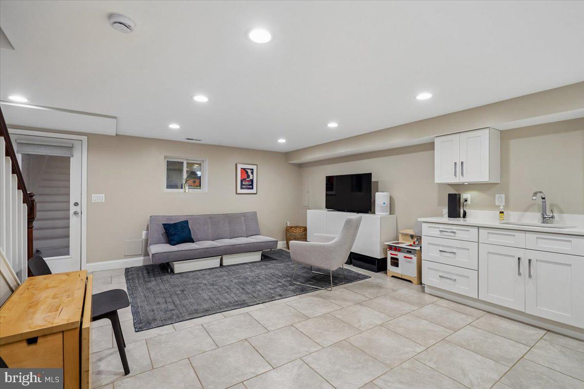 1203 Staples Street Northeast Washington, DC 20002 - Photo 35 of 51 Modern basement retreat with sleek finishes.