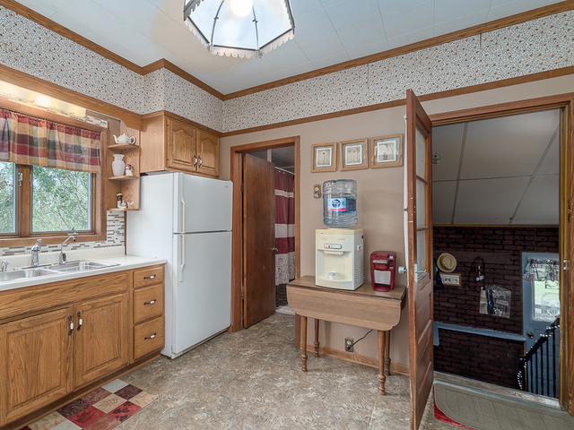 17447 West 2000N Road Reddick, IL 60961 - Photo 12 of 37 a kitchen with white cabinets and refrigerator
