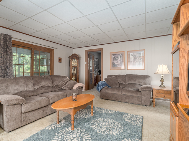 17447 West 2000N Road Reddick, IL 60961 - Photo 13 of 37 a living room with furniture a large window and a rug