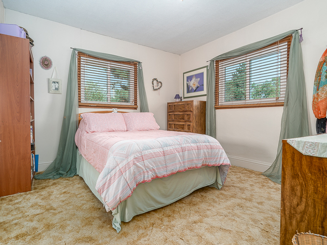 17447 West 2000N Road Reddick, IL 60961 - Photo 19 of 37 a bed sitting in a bedroom next to a window