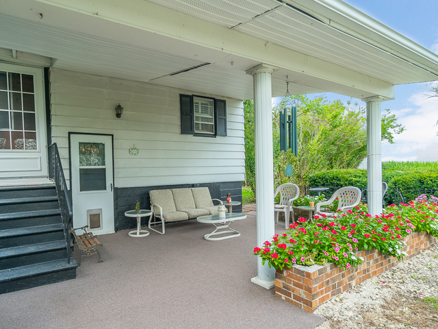 17447 West 2000N Road Reddick, IL 60961 - Photo 36 of 37 a view of a patio with table and chairs and potted plants