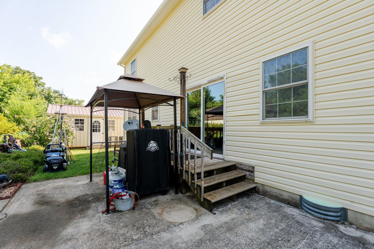 107 Orchard Road Staunton, VA 24401 - Photo 28 of 44 a view of a patio with a table and chairs under an umbrella