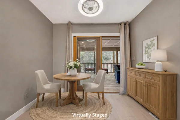 a dining room with furniture and window