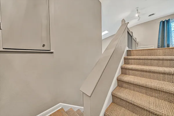 a view of staircase with white walls