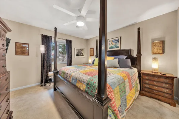 a bed room with a bed and a dresser
