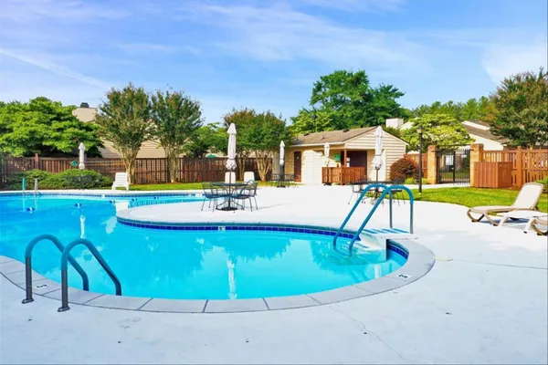 a view of a swimming pool in he middle of the house