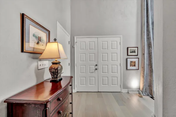a view of room with cabinet and hallway