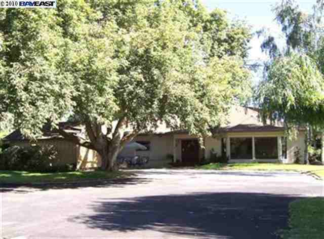 5400 Fig Road Manteca, CA 95337 - Photo 1 of 1 a view of a house with a yard and large tree