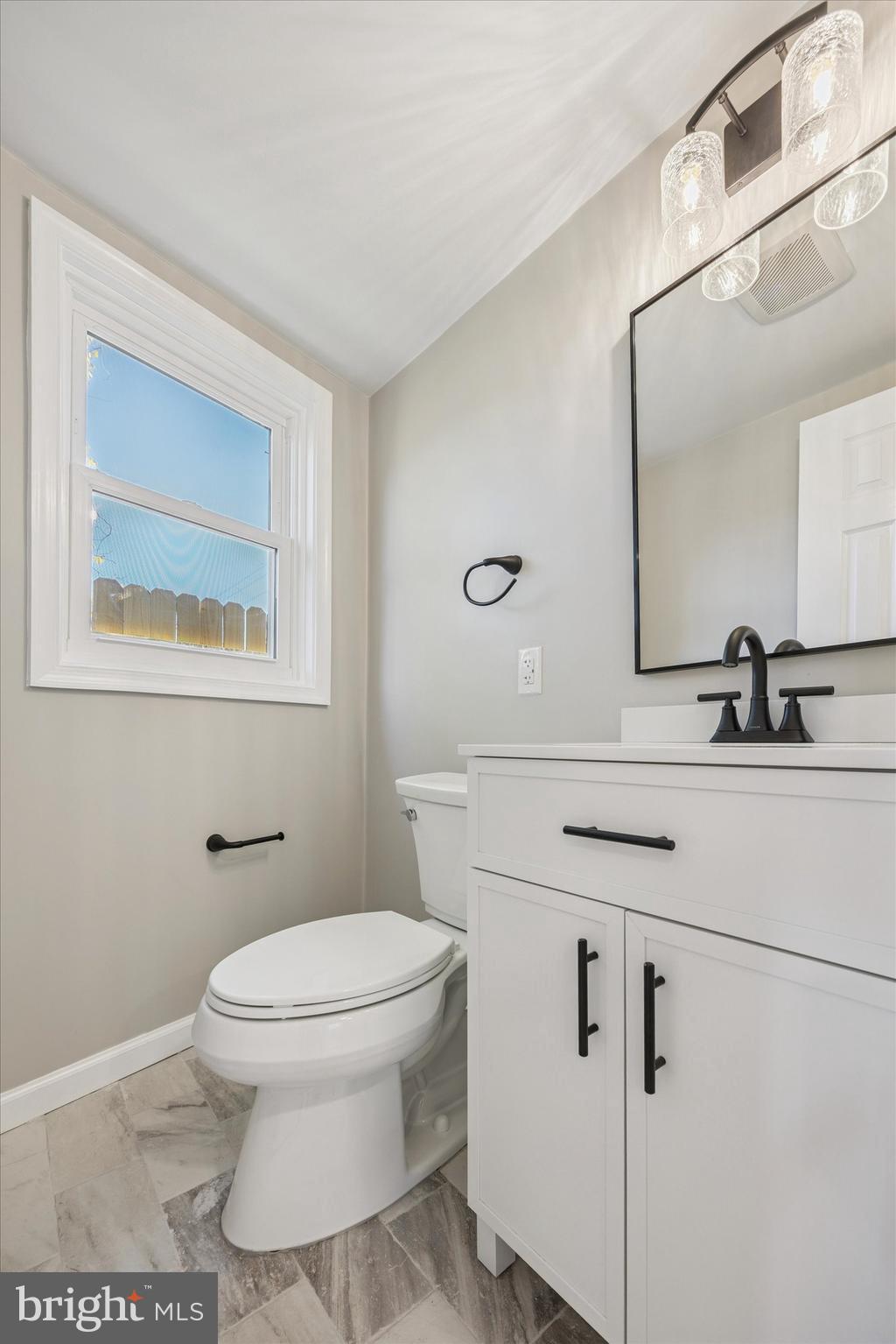 3011 Church Road Lafayette Hill, PA 19444 - Photo 12 of 30 a bathroom with a toilet a sink and mirror