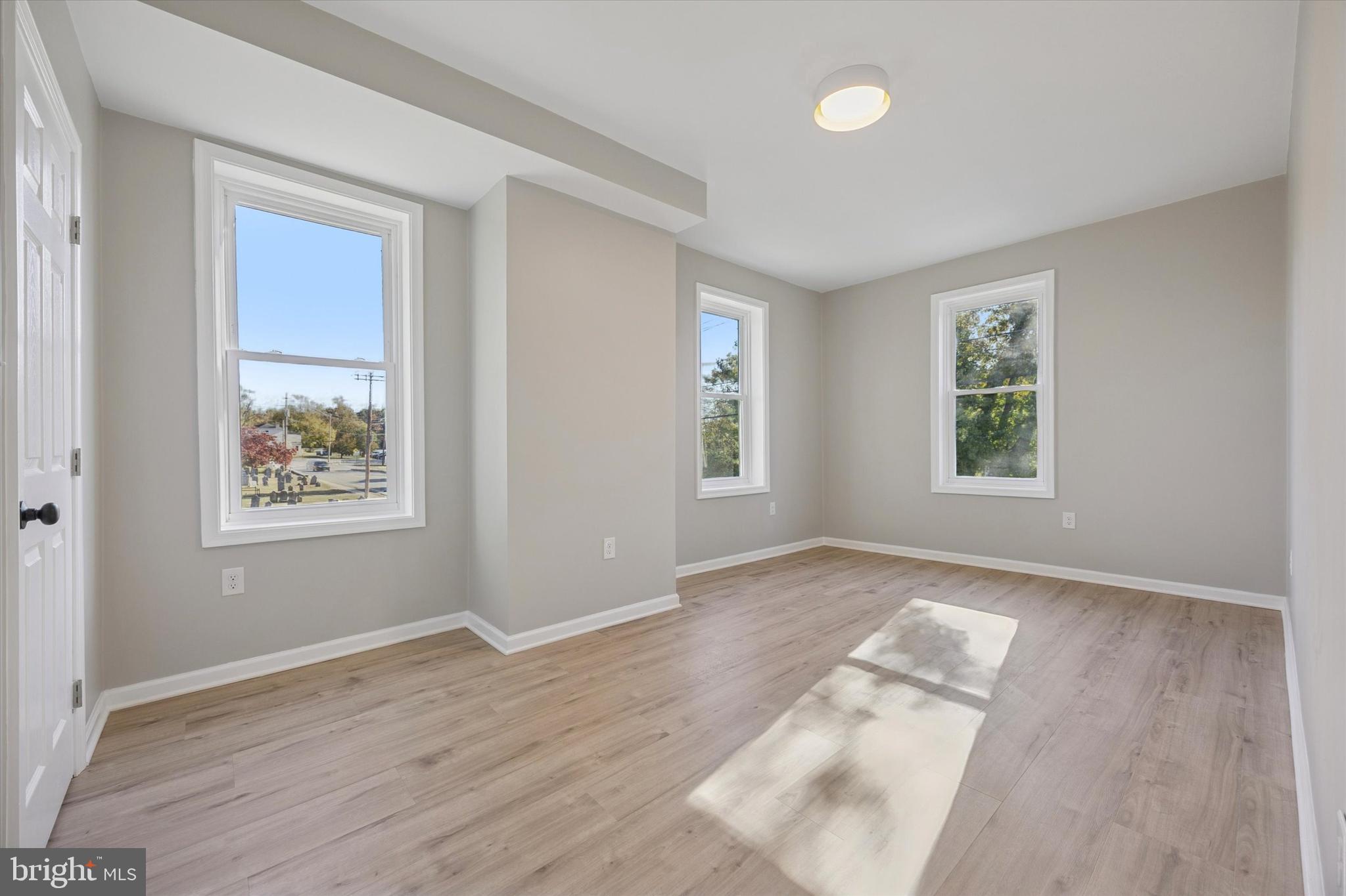 3011 Church Road Lafayette Hill, PA 19444 - Photo 16 of 30 a view of an empty room with wooden floor and a window