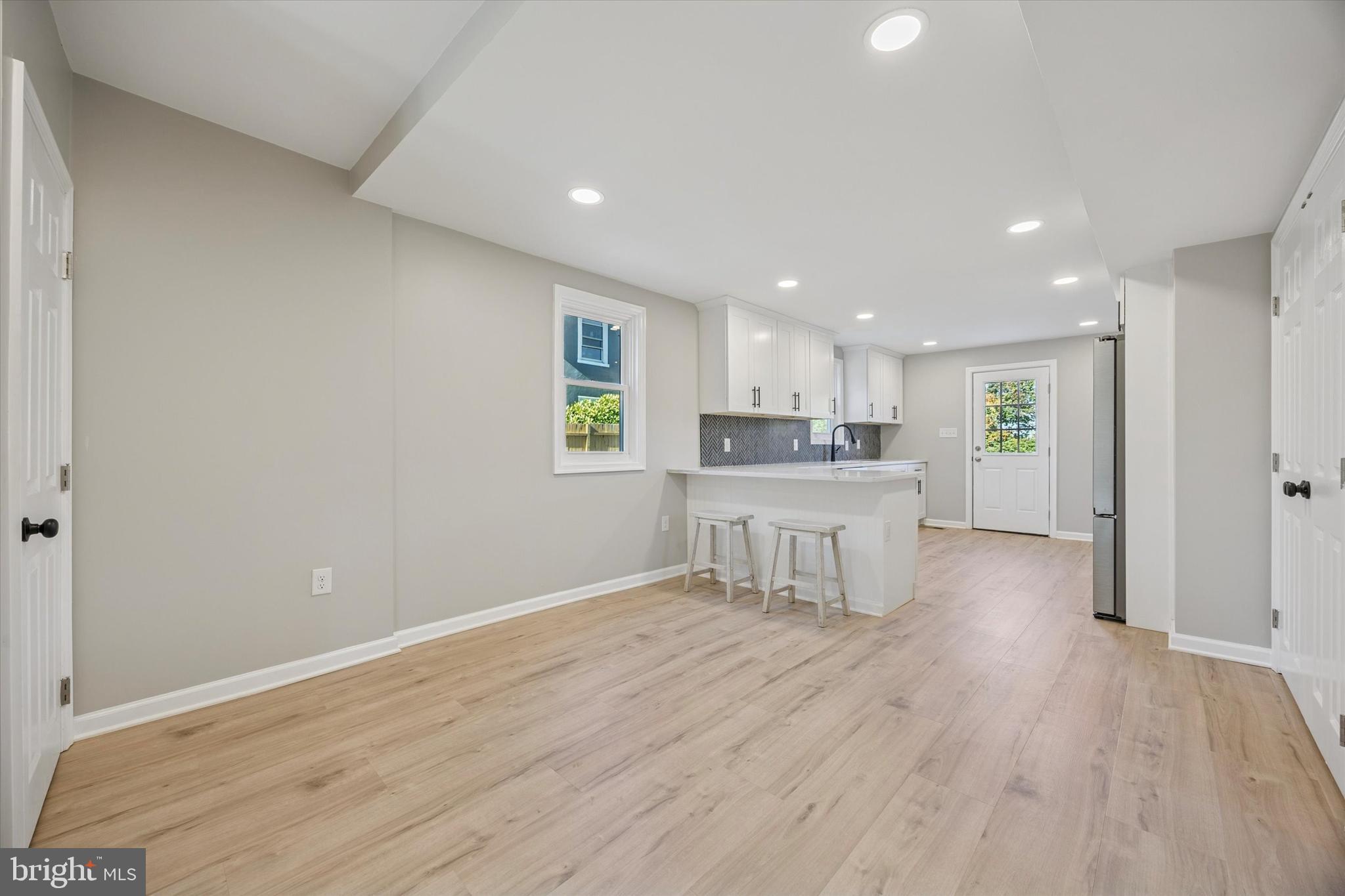 3011 Church Road Lafayette Hill, PA 19444 - Photo 6 of 30 a open kitchen with a refrigerator and a sink