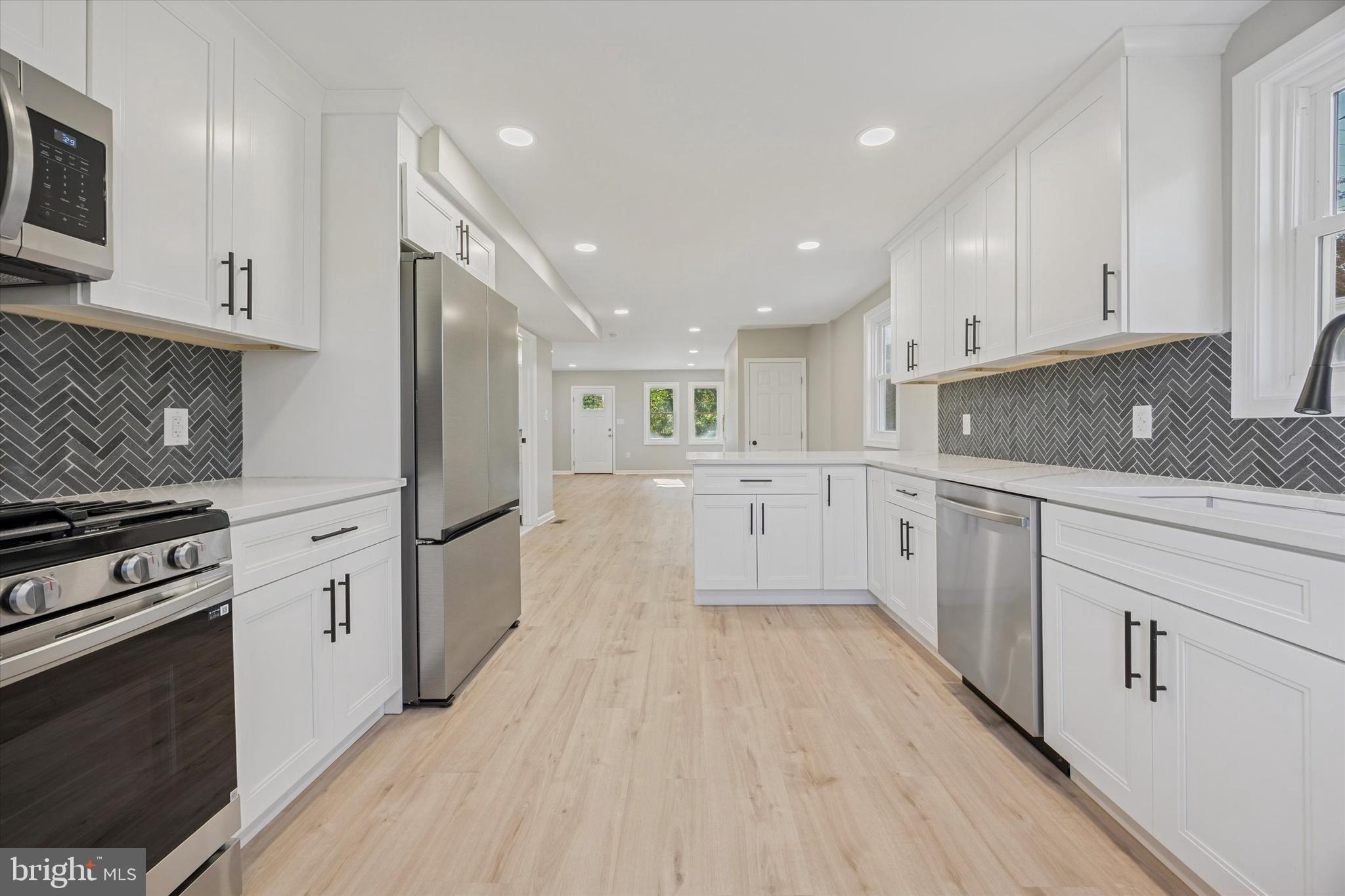 3011 Church Road Lafayette Hill, PA 19444 - Photo 10 of 30 a large kitchen with a stove top oven
