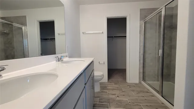 a bathroom with a sink a mirror and a shower
