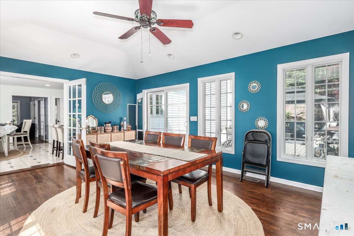 55 A Flax Hill Road Brookfield, CT 06804 - Photo 15 of 40 a view of a dining room with furniture window and wooden floor