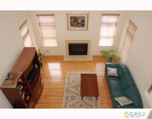 116 Harding Avenue Edison, NJ 08820 - Photo 1 of 10 a living room with furniture and a flat screen tv