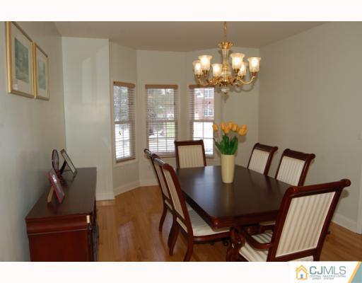 116 Harding Avenue Edison, NJ 08820 - Photo 3 of 10 a view of a dining room with furniture and chandelier