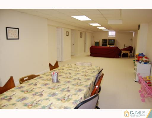 116 Harding Avenue Edison, NJ 08820 - Photo 8 of 10 a living room with furniture and a table