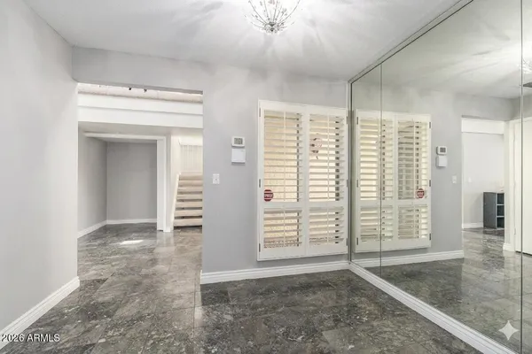 a view of a livingroom with wooden floor and flat screen tv