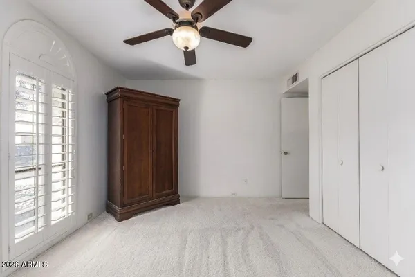 a white toilet sitting next to a bathroom sink
