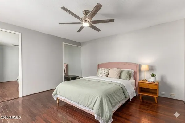 a bathroom with a granite countertop sink and mirror