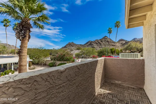 a view of a chairs and table in the patio