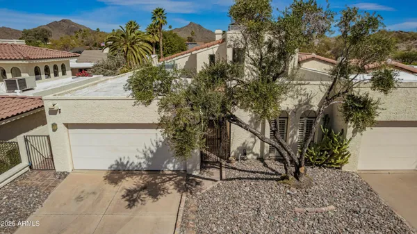 a view of a balcony with chairs and wooden floor
