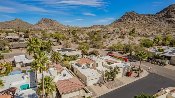 a view of a park with large trees