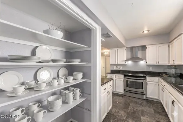 a kitchen with a refrigerator and a sink