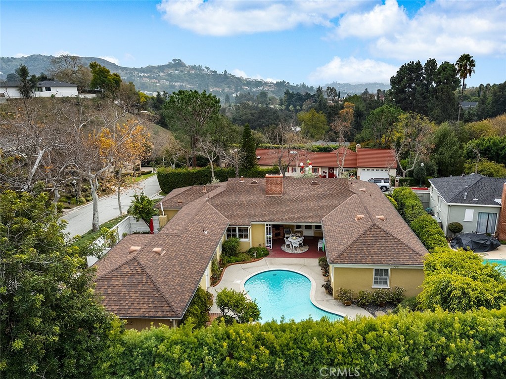 an aerial view of a house with yard swimming pool and outdoor seating